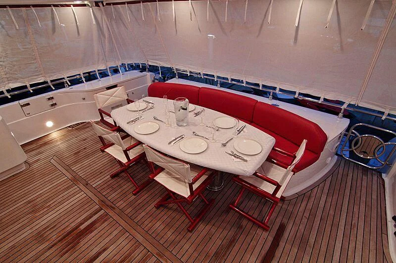 a table set for a dinner party aboard GEMINIS Yacht for Sale