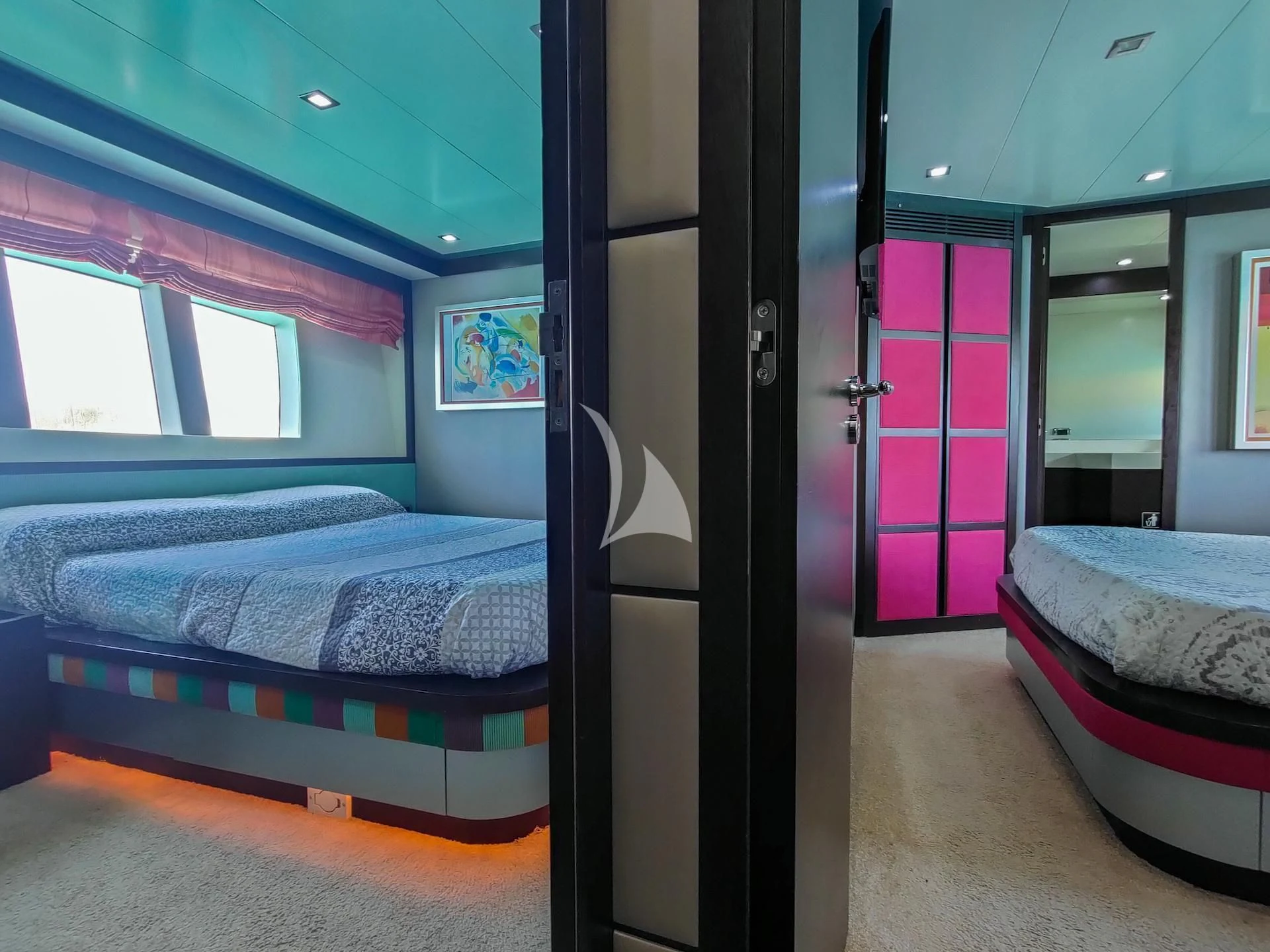 a room with a bed and a door aboard GEMINIS Yacht for Sale