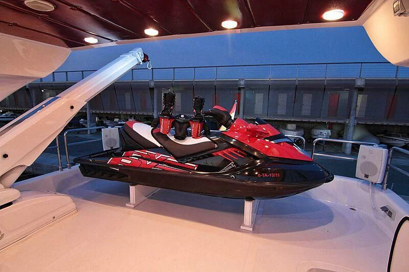 a couple of race cars on a track aboard GEMINIS Yacht for Sale