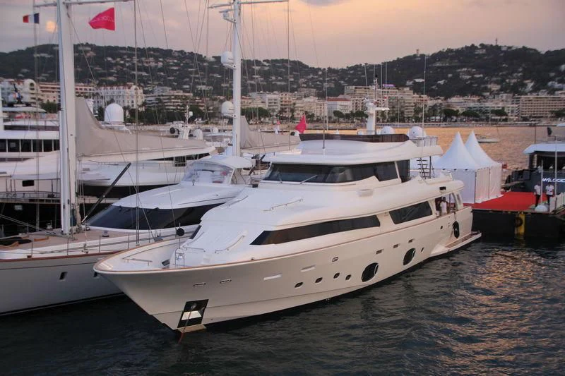 a couple of white yachts in a harbor aboard SKY Yacht for Sale
