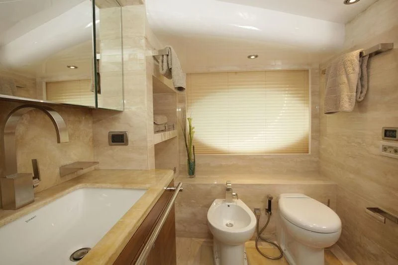 a bathroom with a toilet and a sink aboard SEAHORSE Yacht for Sale