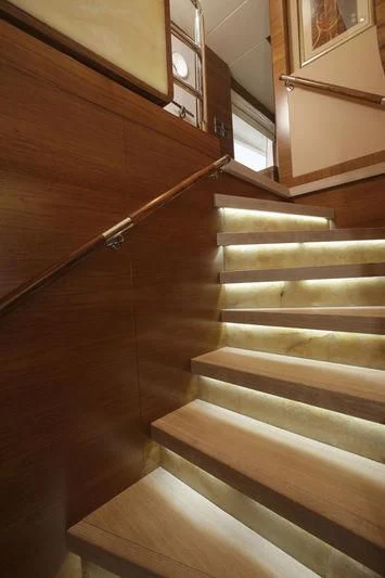 a wooden staircase with a light on aboard SEAHORSE Yacht for Sale