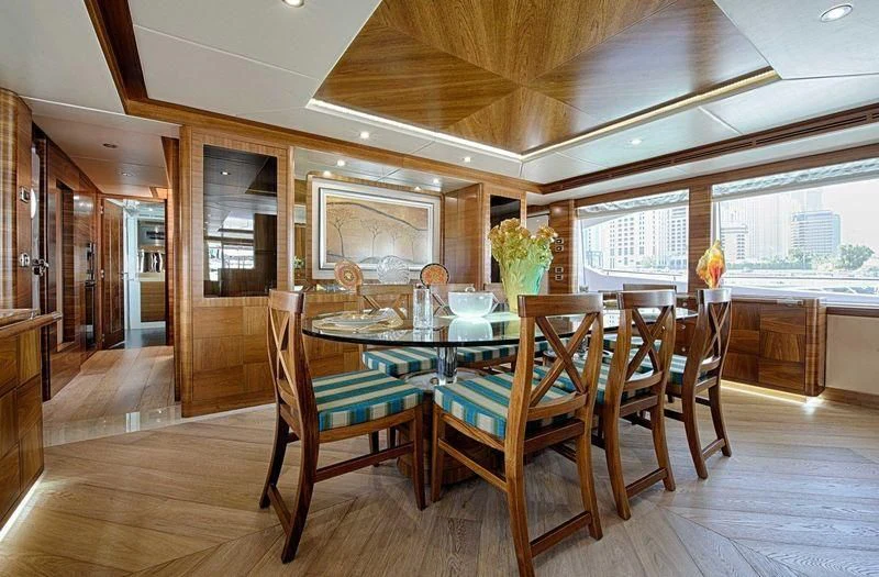 a dining room with a table and chairs aboard SEAHORSE Yacht for Sale