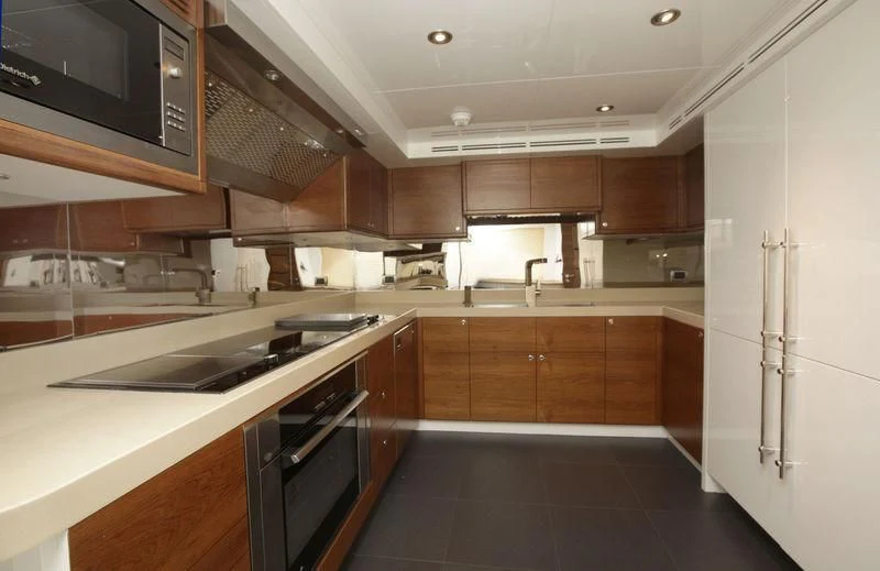 a kitchen with a stove and microwave aboard SEAHORSE Yacht for Sale