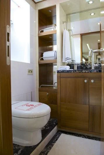 a bathroom with a toilet and a sink aboard SEAHORSE Yacht for Sale