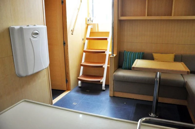 a room with a couch and a table aboard SEAHORSE Yacht for Sale