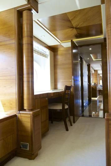 a room with a chair and a table aboard SEAHORSE Yacht for Sale