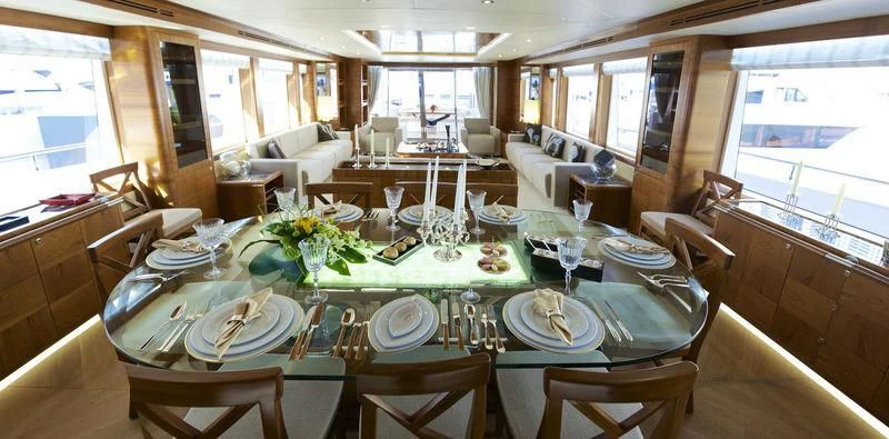 a dining room with a table set aboard SEAHORSE Yacht for Sale
