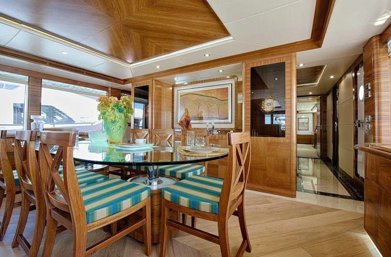 a dining room with a table and chairs aboard SEAHORSE Yacht for Sale