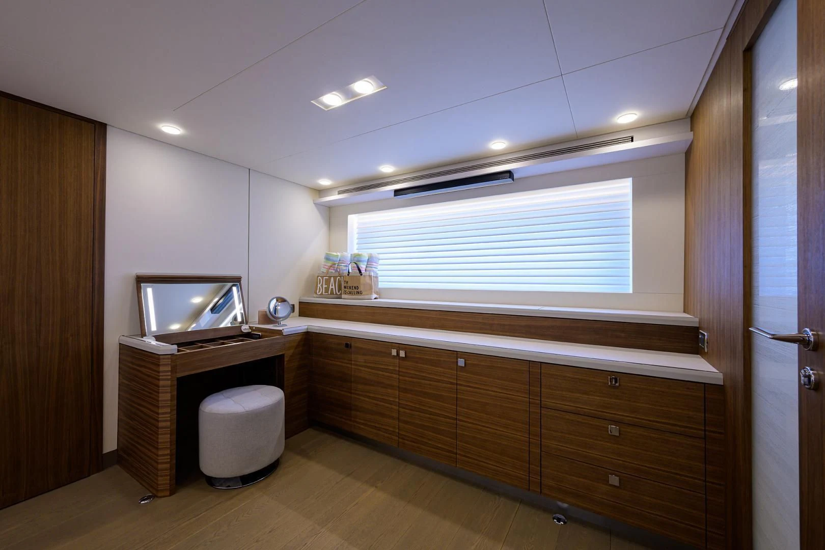 a room with a tv and cabinets aboard MY 3 GALS Yacht for Sale