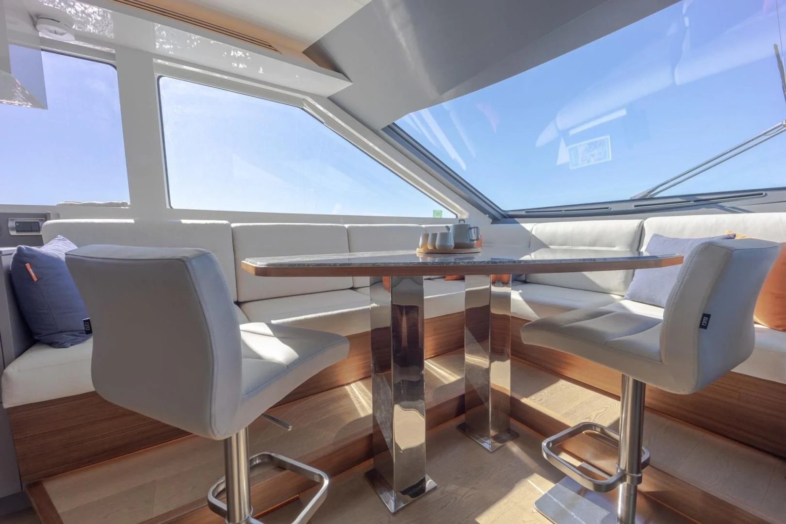 a table and chairs in a room aboard MY 3 GALS Yacht for Sale