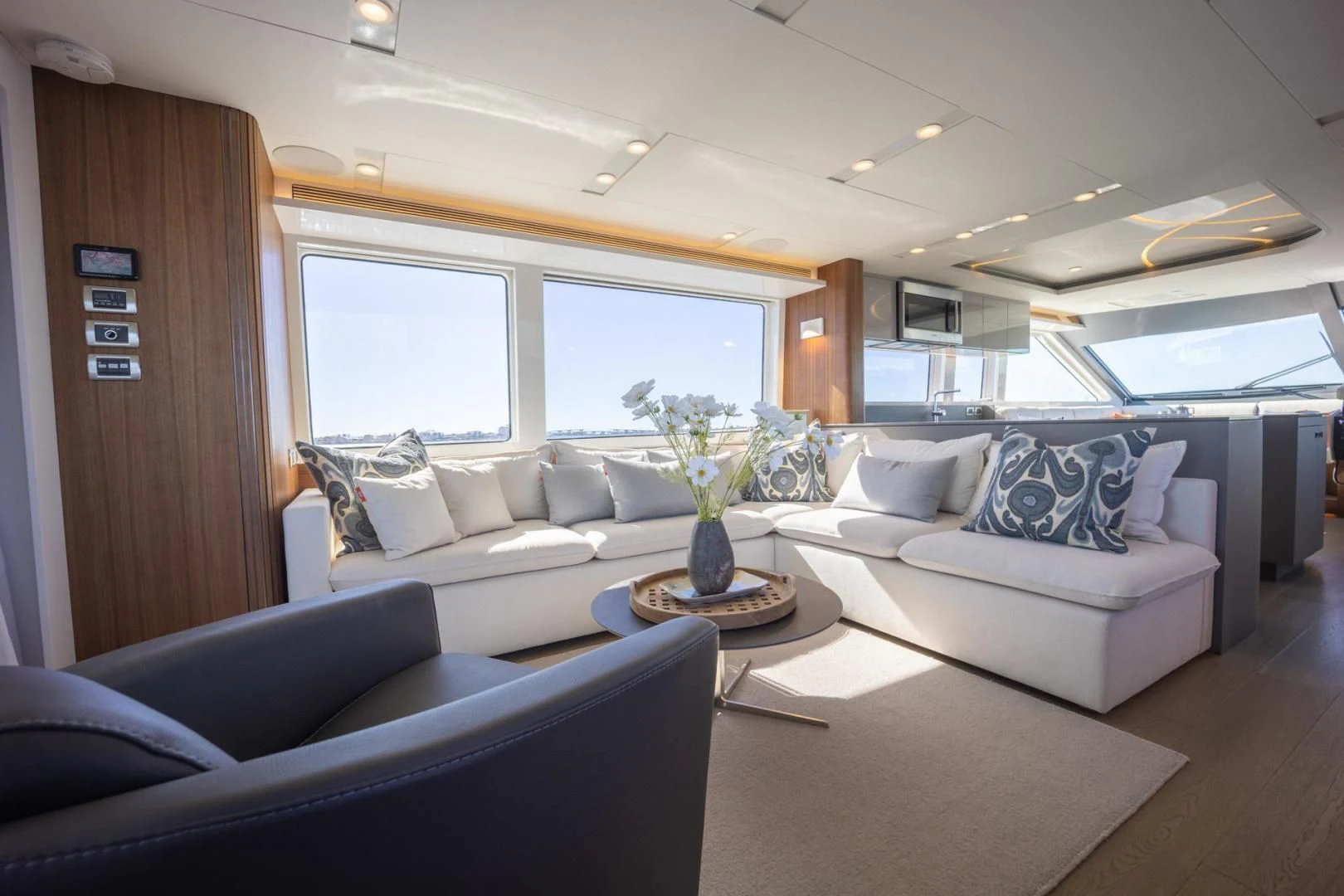 a living room with a couch and a coffee table aboard MY 3 GALS Yacht for Sale