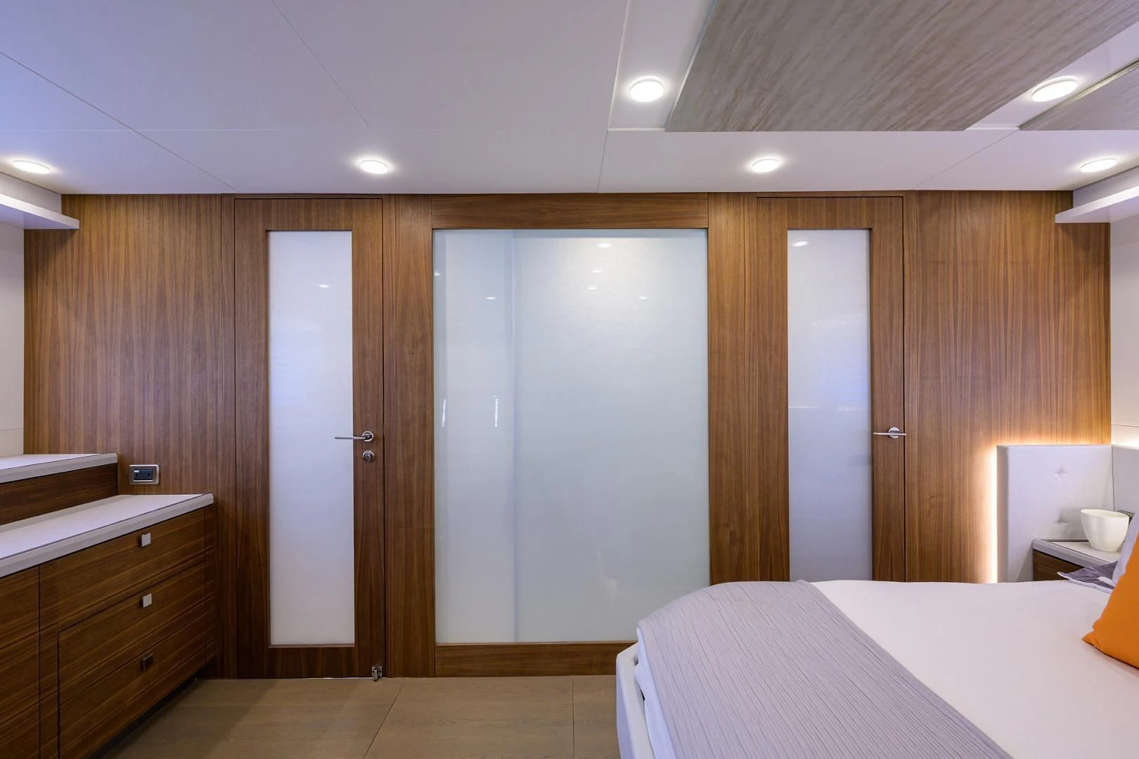 a room with a bed and a closet aboard MY 3 GALS Yacht for Sale