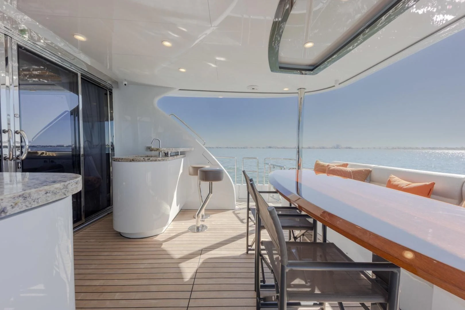 a room with a table and chairs aboard MY 3 GALS Yacht for Sale