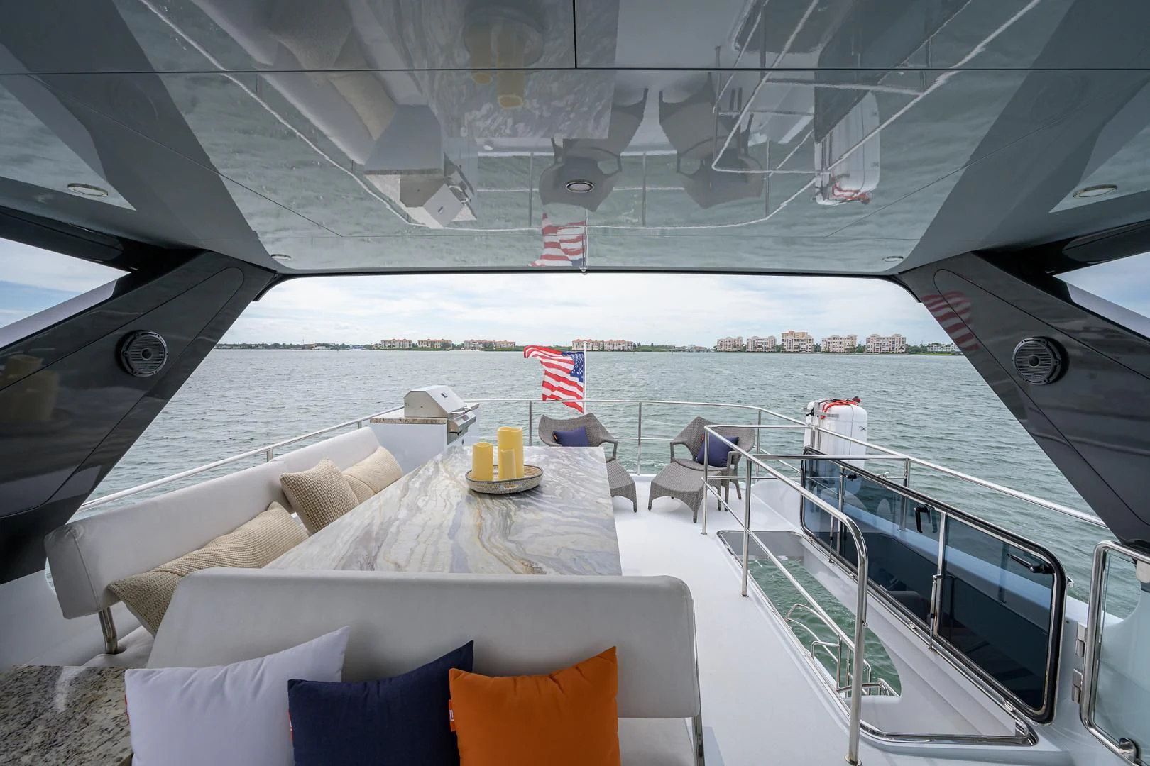 a deck with a view of the ocean and the beach aboard MY 3 GALS Yacht for Sale