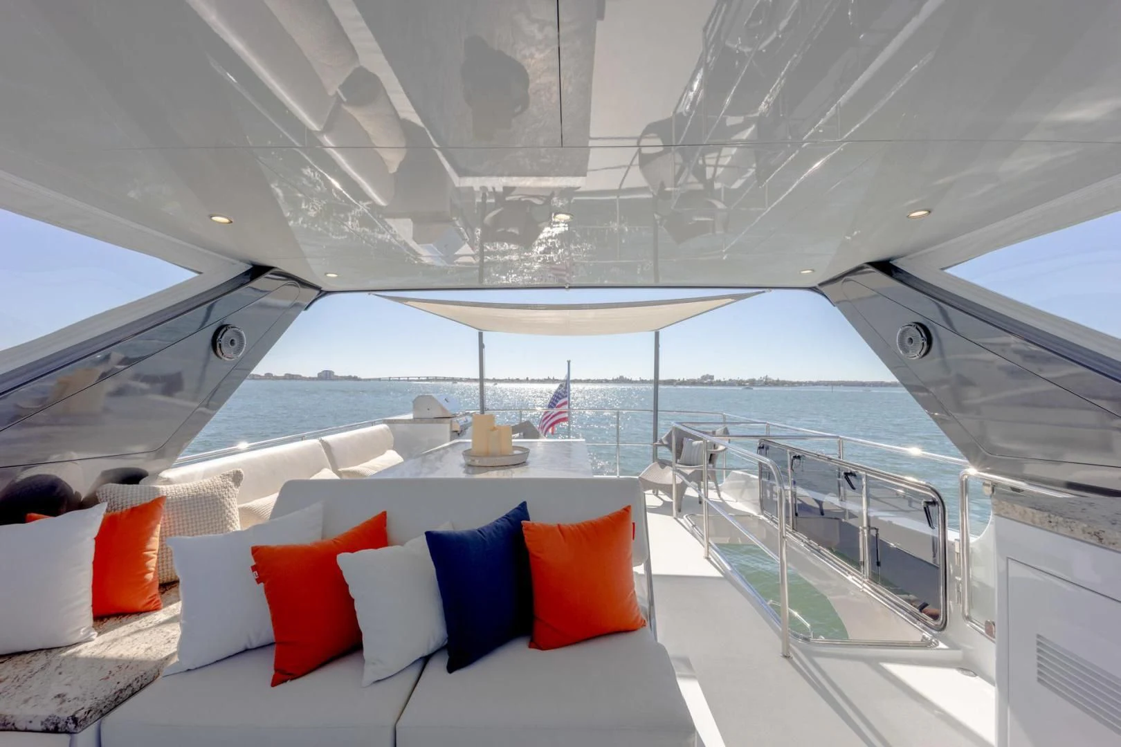 a room with a view of the ocean and a large cruise ship aboard MY 3 GALS Yacht for Sale