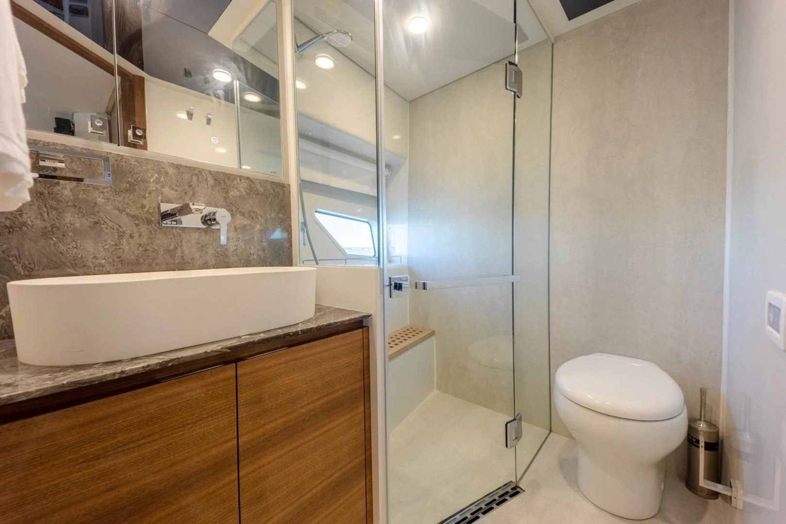 a bathroom with a glass shower aboard MY 3 GALS Yacht for Sale