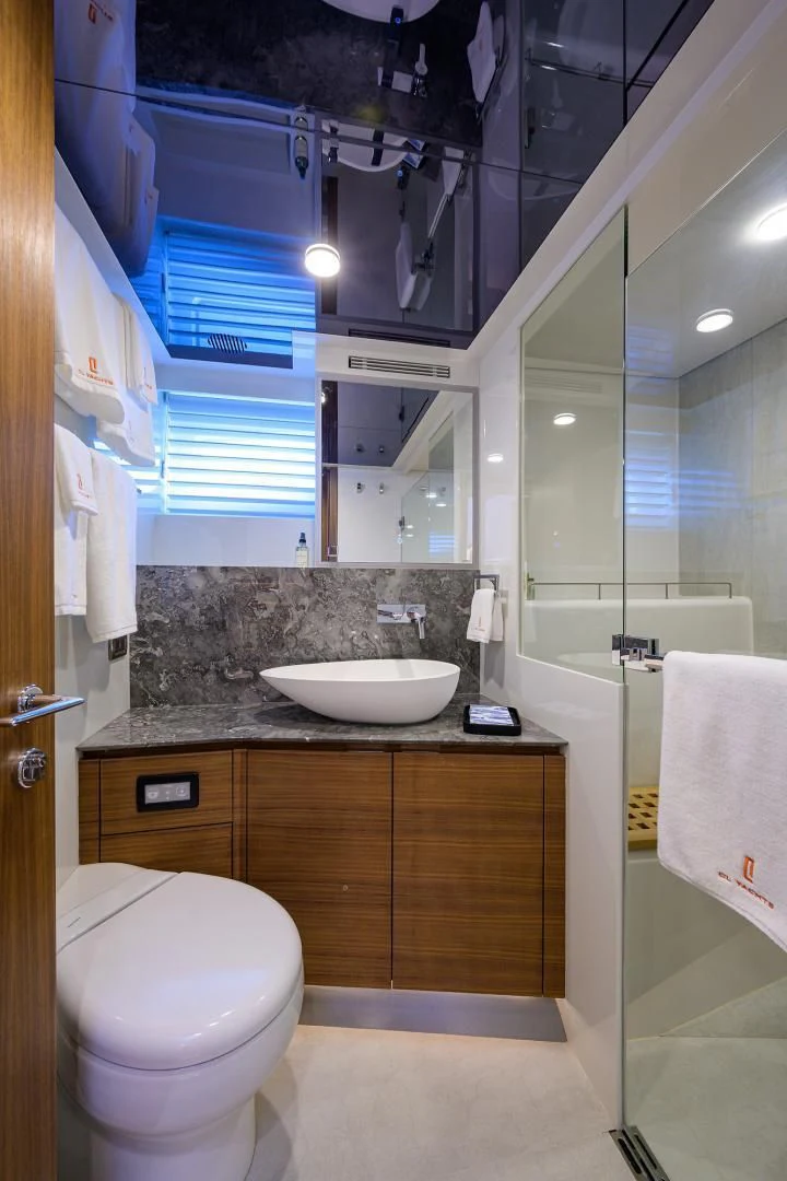 a bathroom with a toilet and sink aboard MY 3 GALS Yacht for Sale