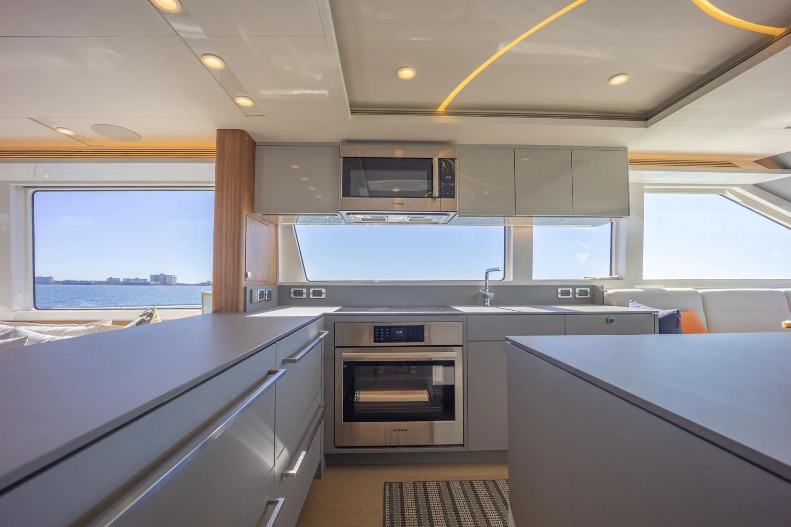a kitchen with white cabinets aboard MY 3 GALS Yacht for Sale