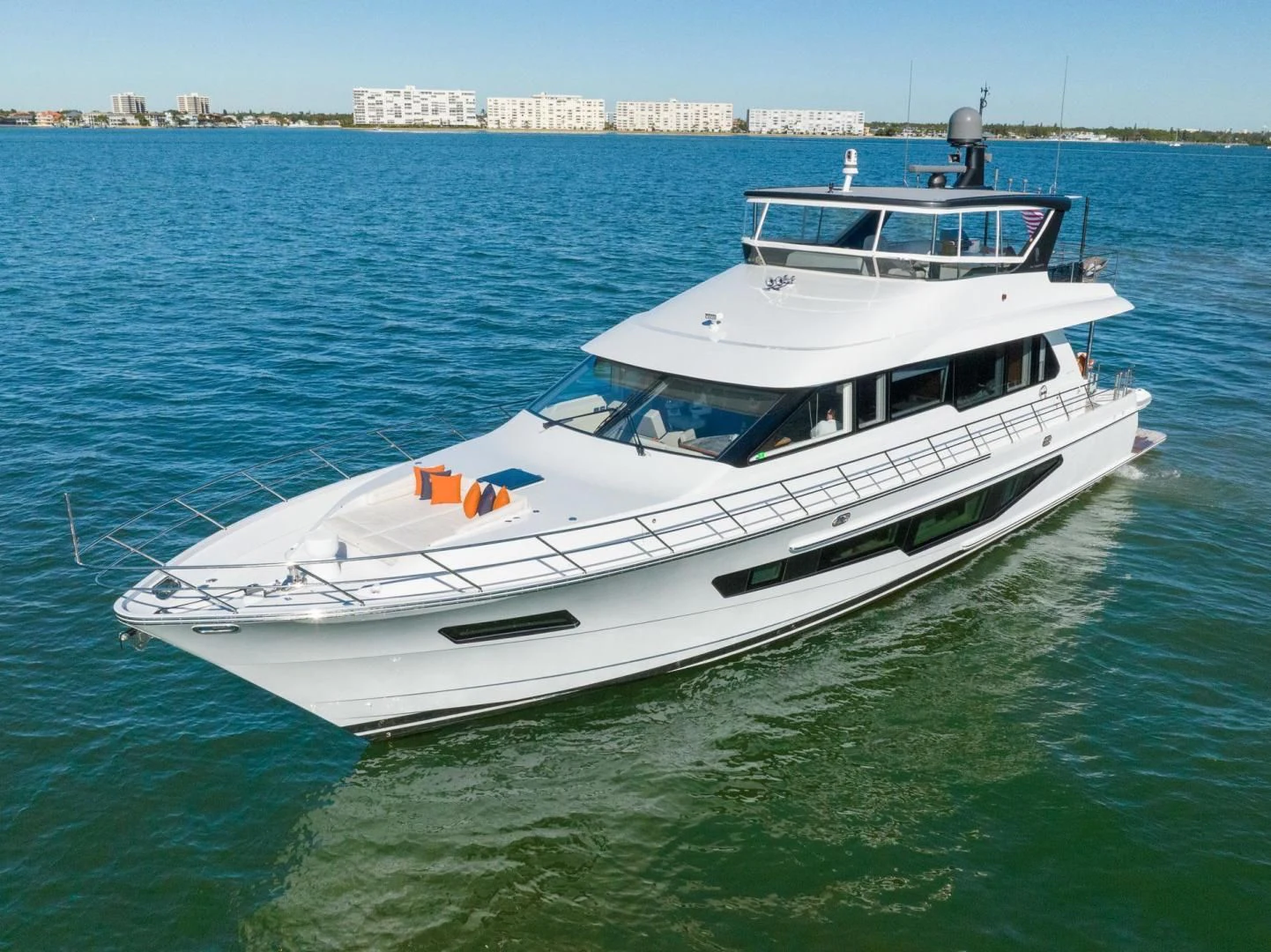 a white yacht in the water aboard MY 3 GALS Yacht for Sale