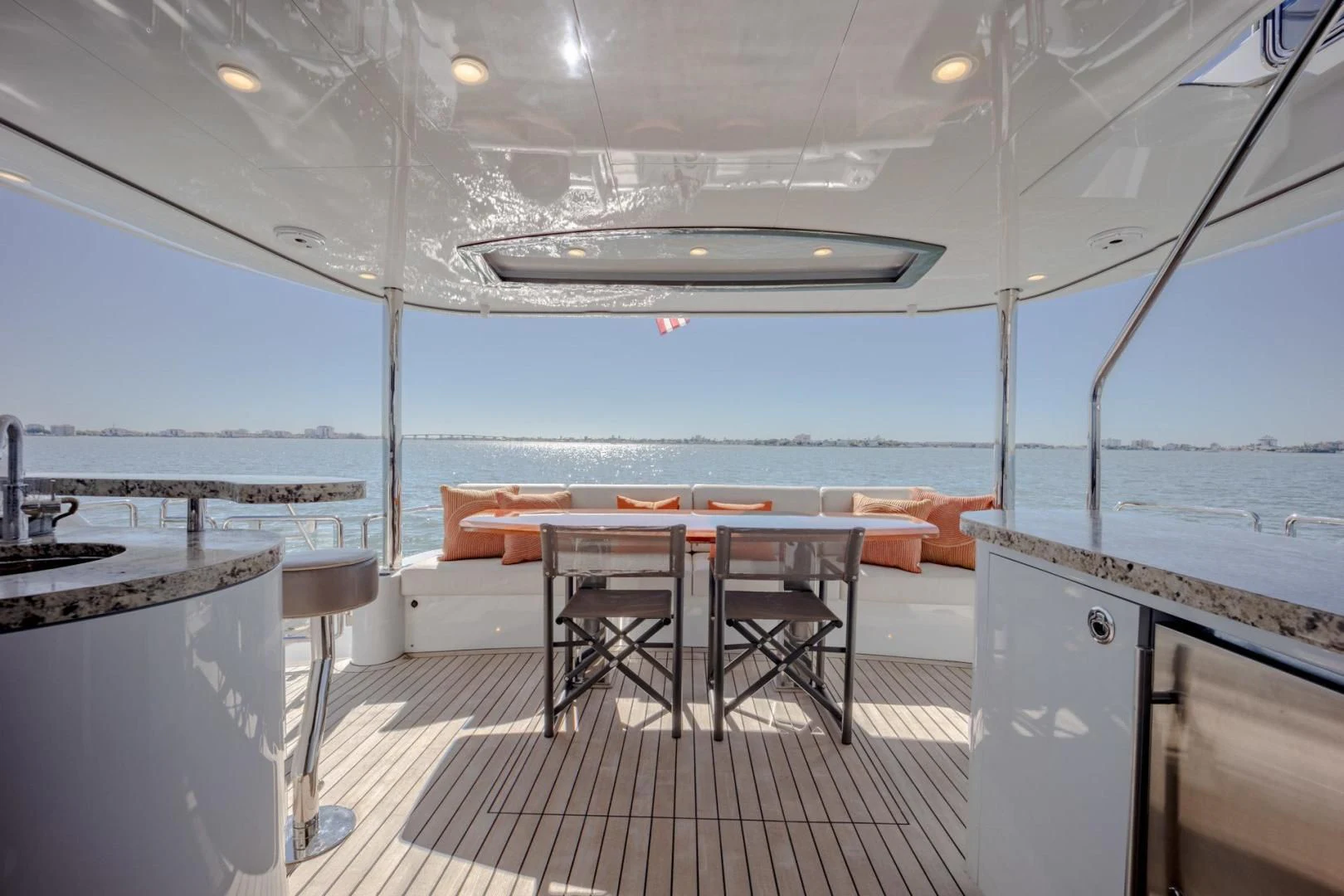 a kitchen with a table and chairs aboard MY 3 GALS Yacht for Sale