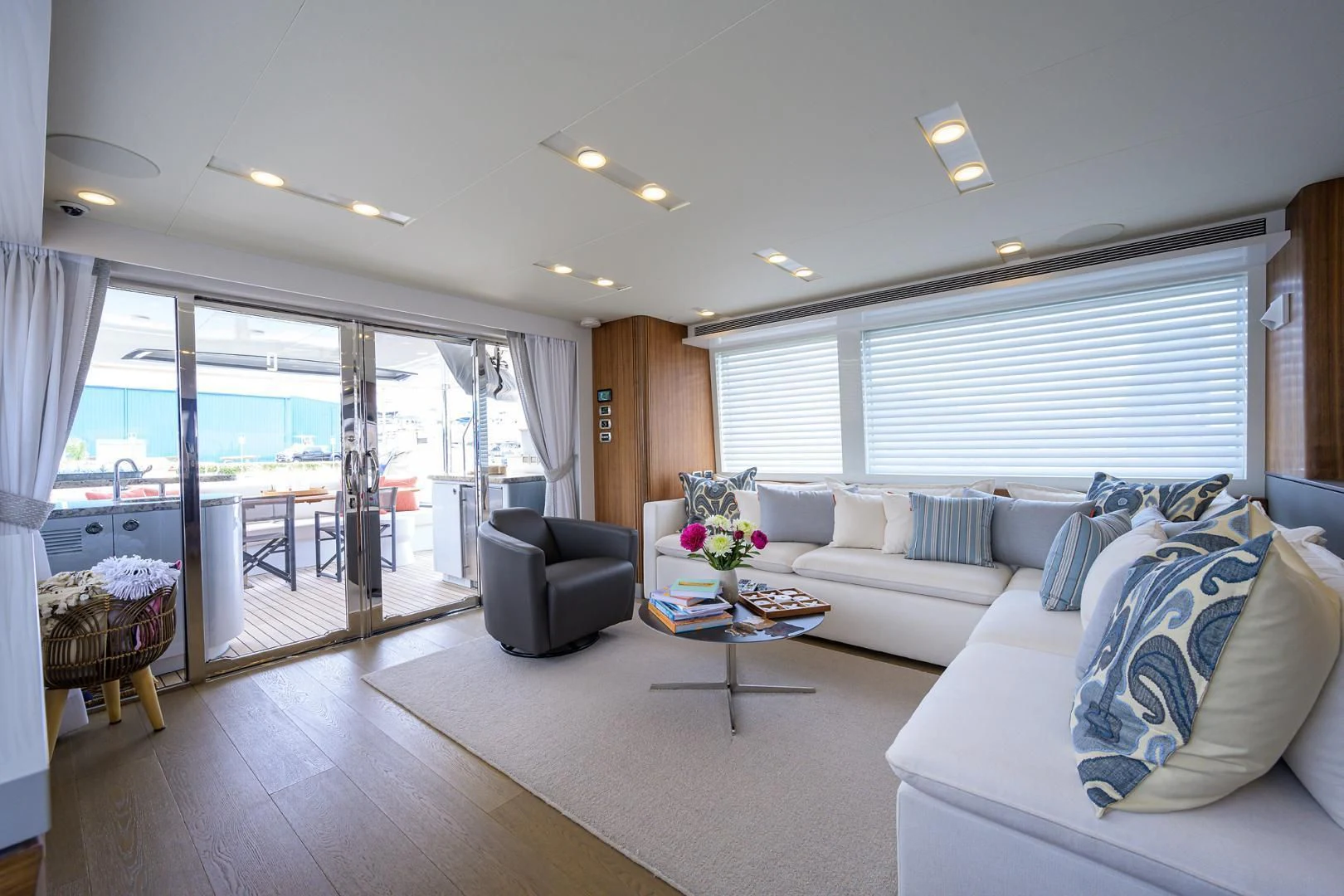 a living room with a large window aboard MY 3 GALS Yacht for Sale