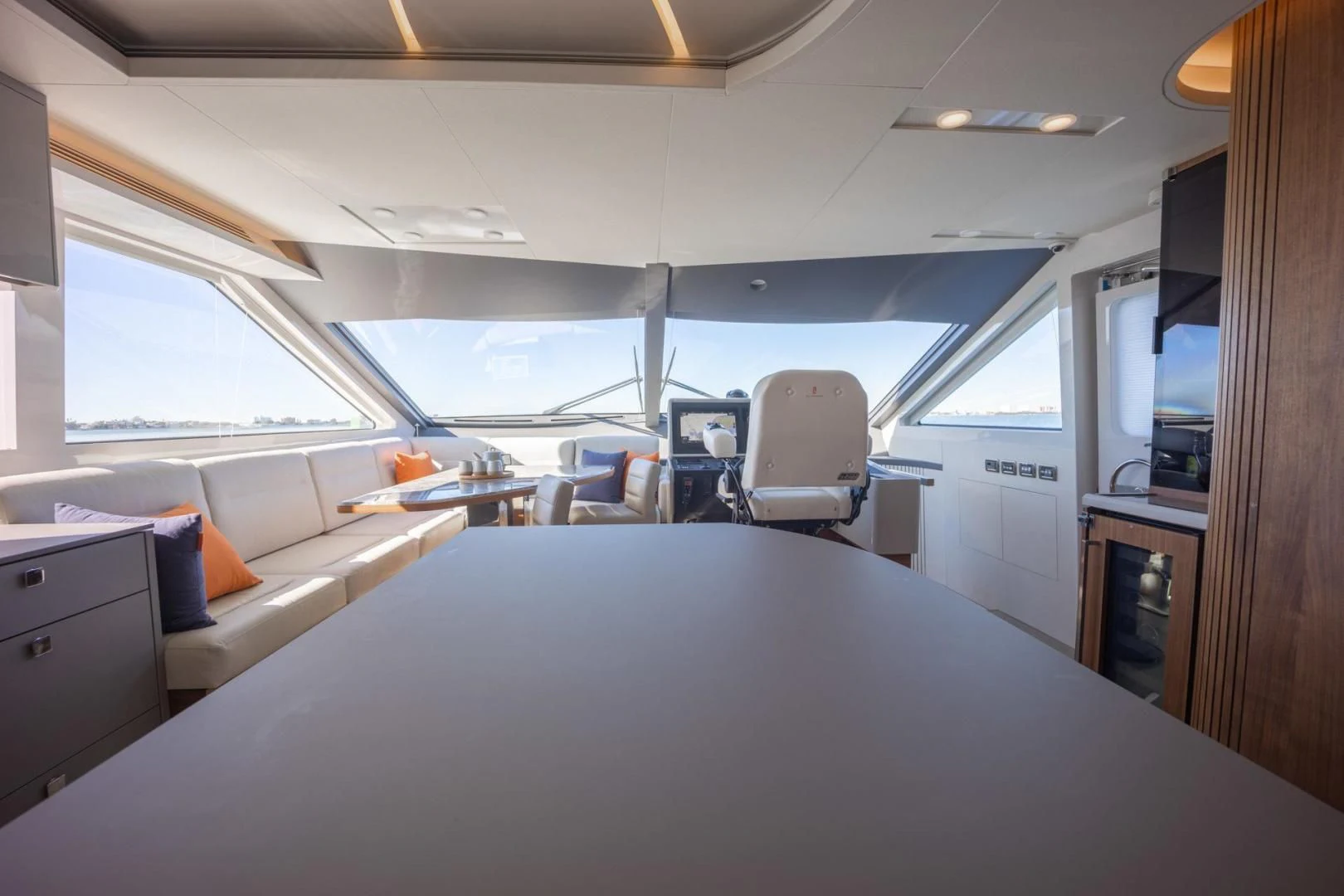 inside of a vehicle with a large white table and chairs aboard MY 3 GALS Yacht for Sale