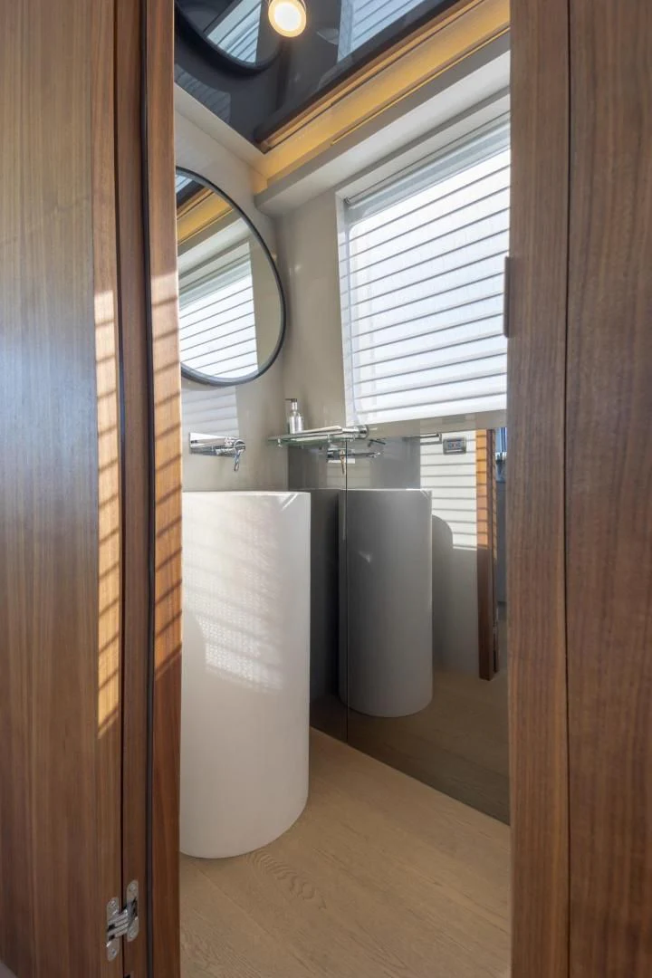 a bathroom with a urinal aboard MY 3 GALS Yacht for Sale