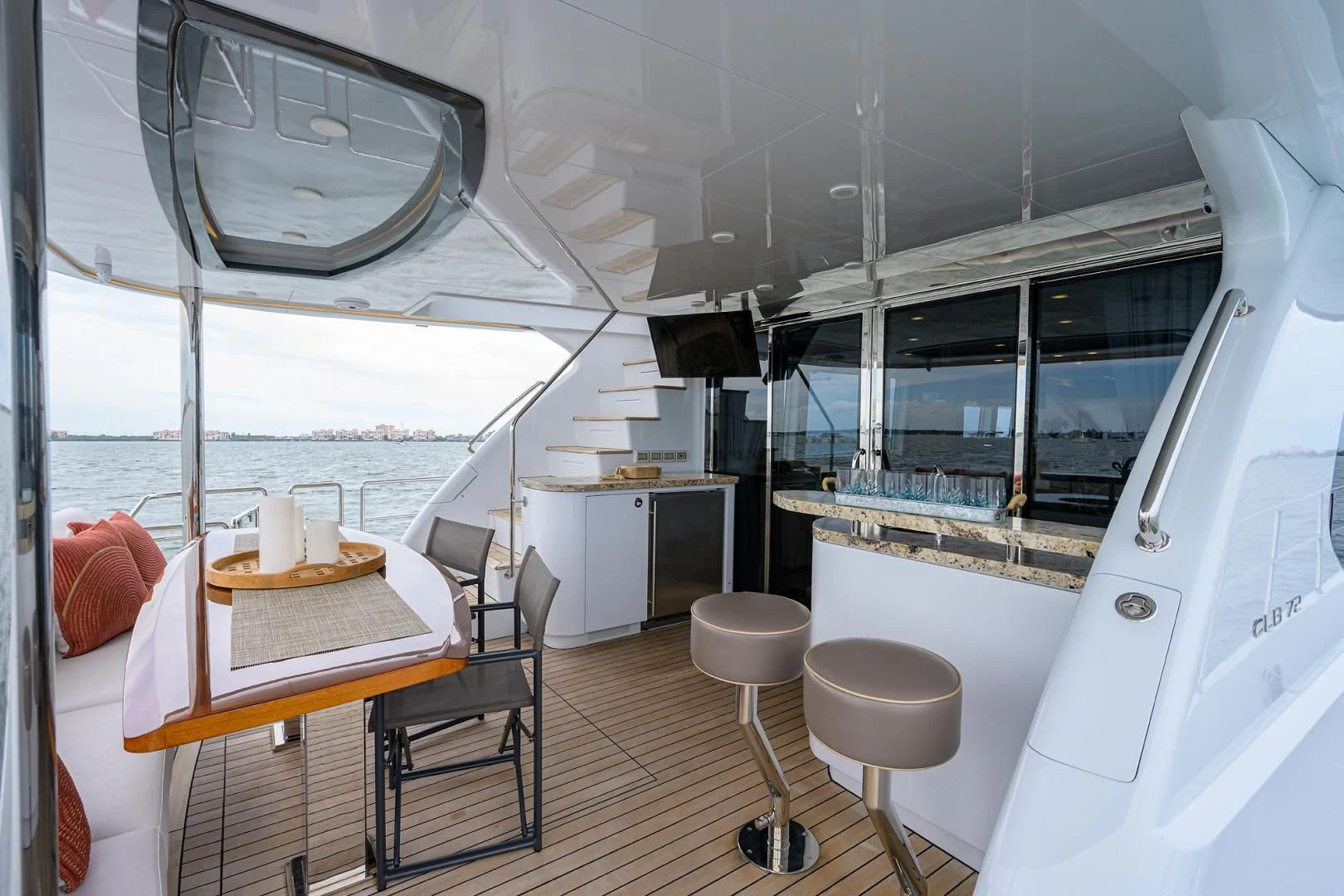 a room with a table and chairs aboard MY 3 GALS Yacht for Sale