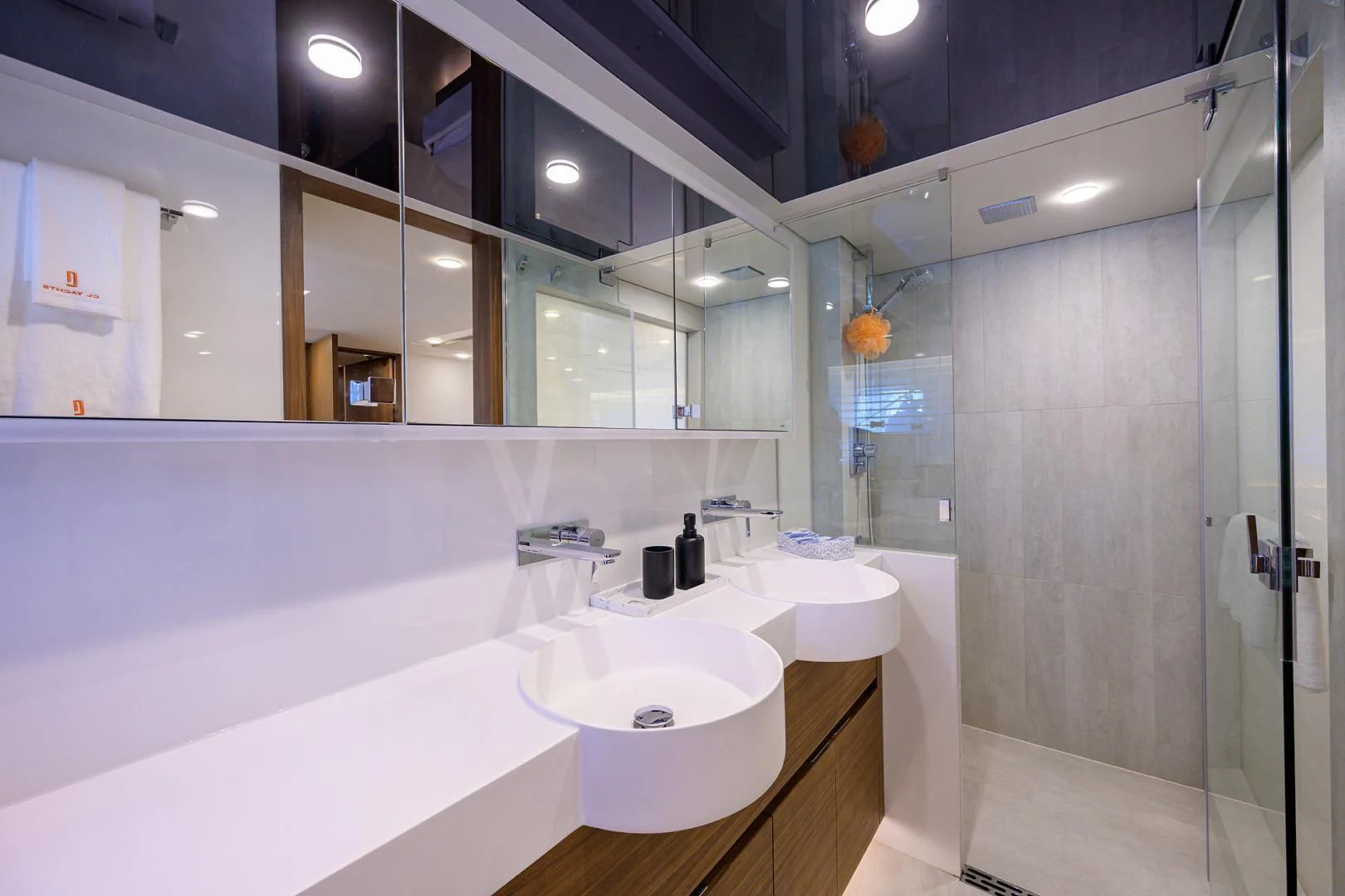 a bathroom with a large mirror aboard MY 3 GALS Yacht for Sale