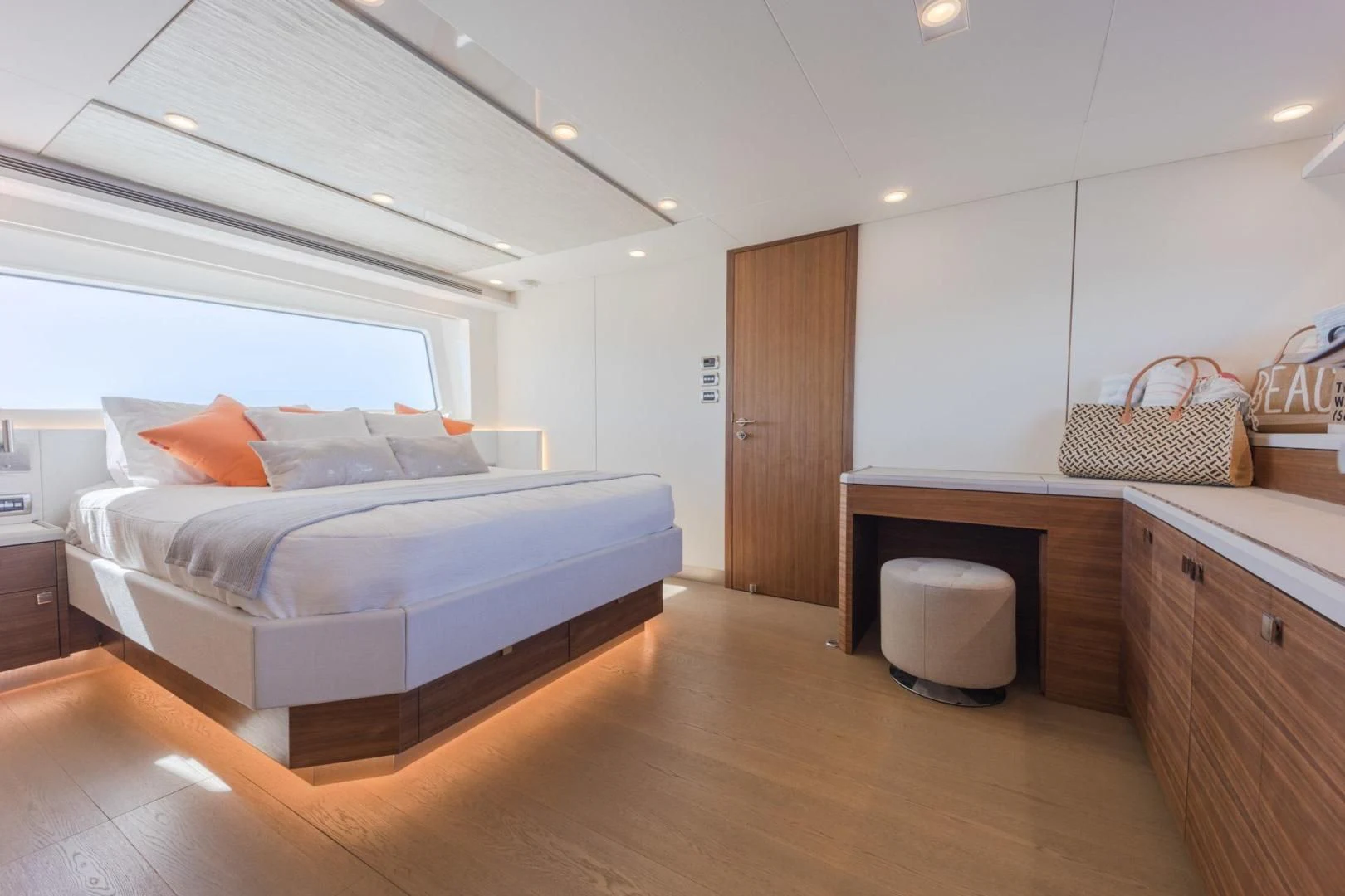 a bedroom with a bed and a dresser aboard MY 3 GALS Yacht for Sale
