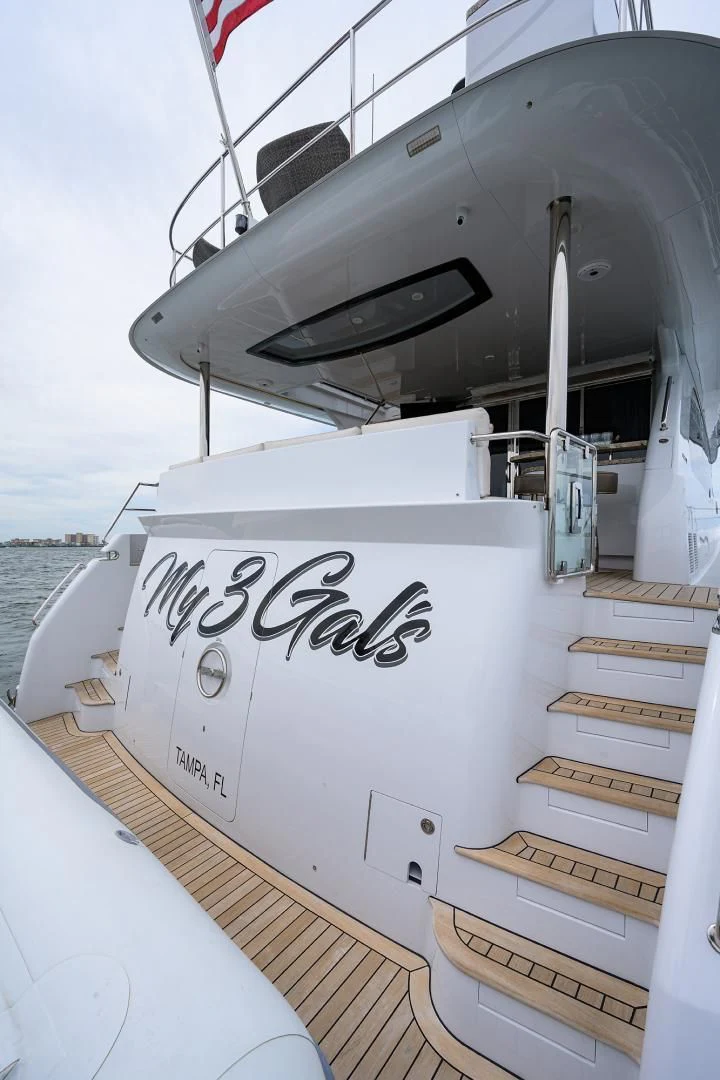 a boat with a sign on the front aboard MY 3 GALS Yacht for Sale