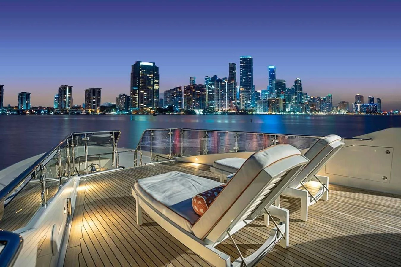 a deck overlooking a city skyline aboard DRILLER Yacht for Sale