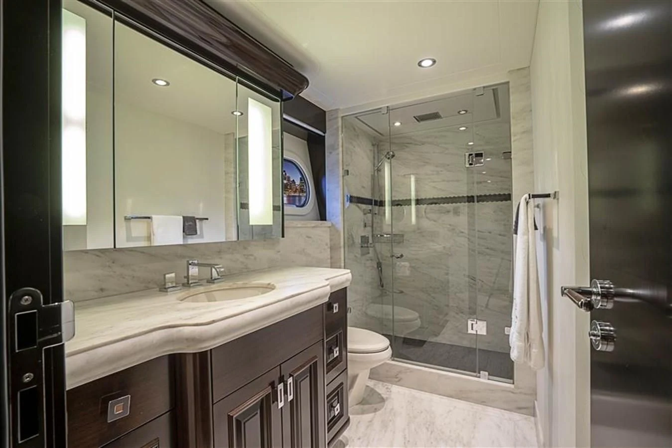 a bathroom with a glass shower aboard DRILLER Yacht for Sale