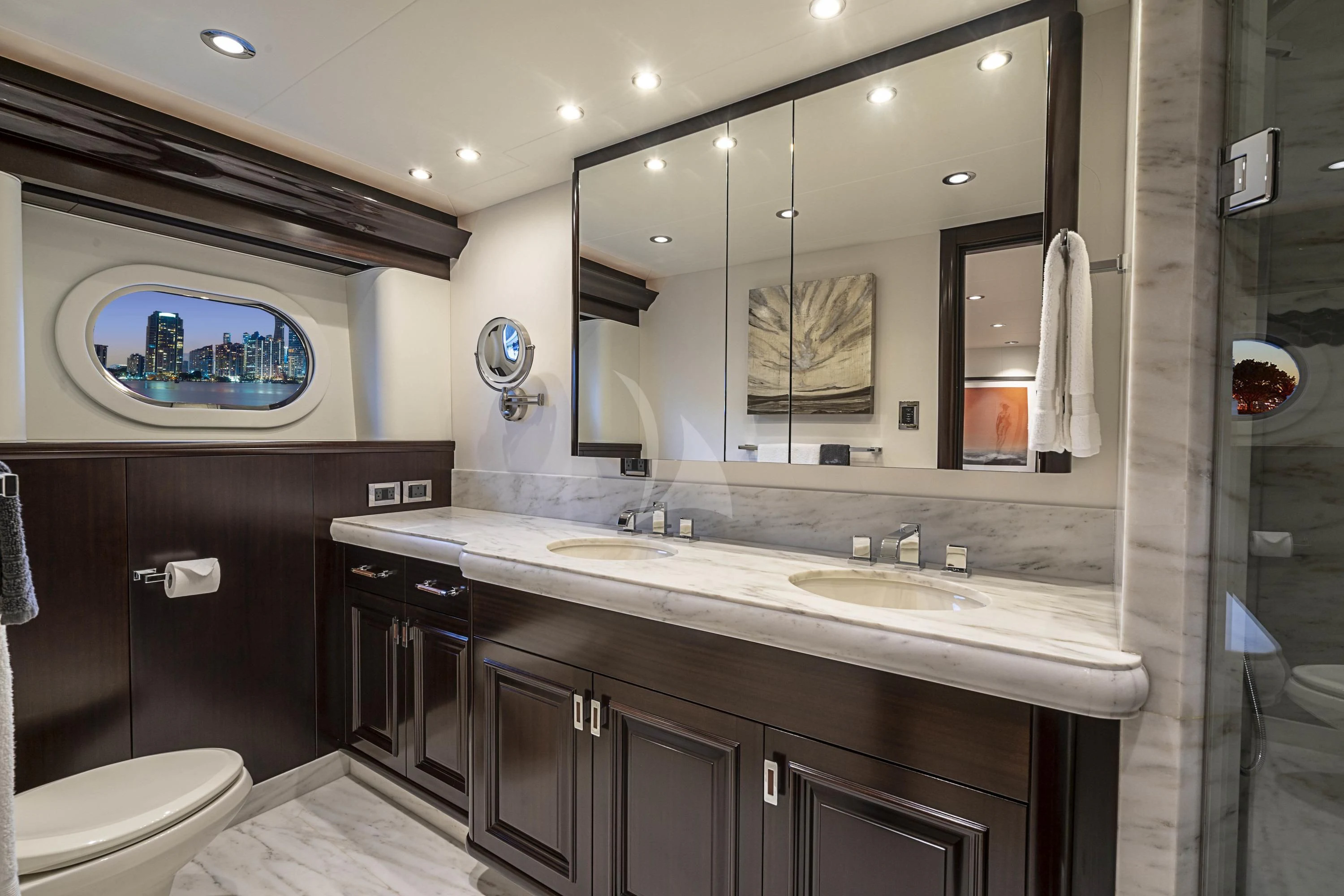 a bathroom with a large mirror aboard DRILLER Yacht for Sale
