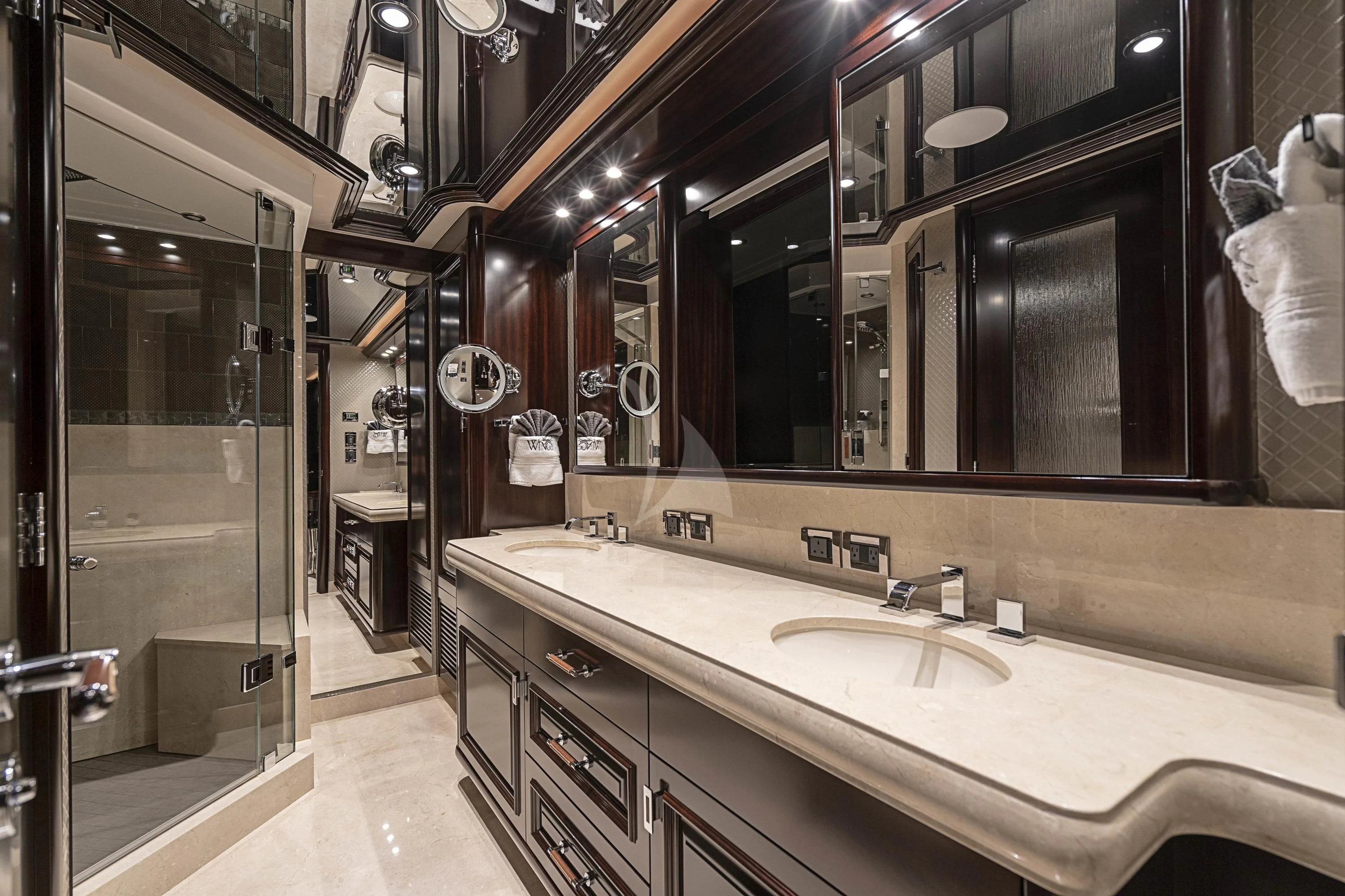 a bathroom with sinks and mirrors aboard DRILLER Yacht for Sale