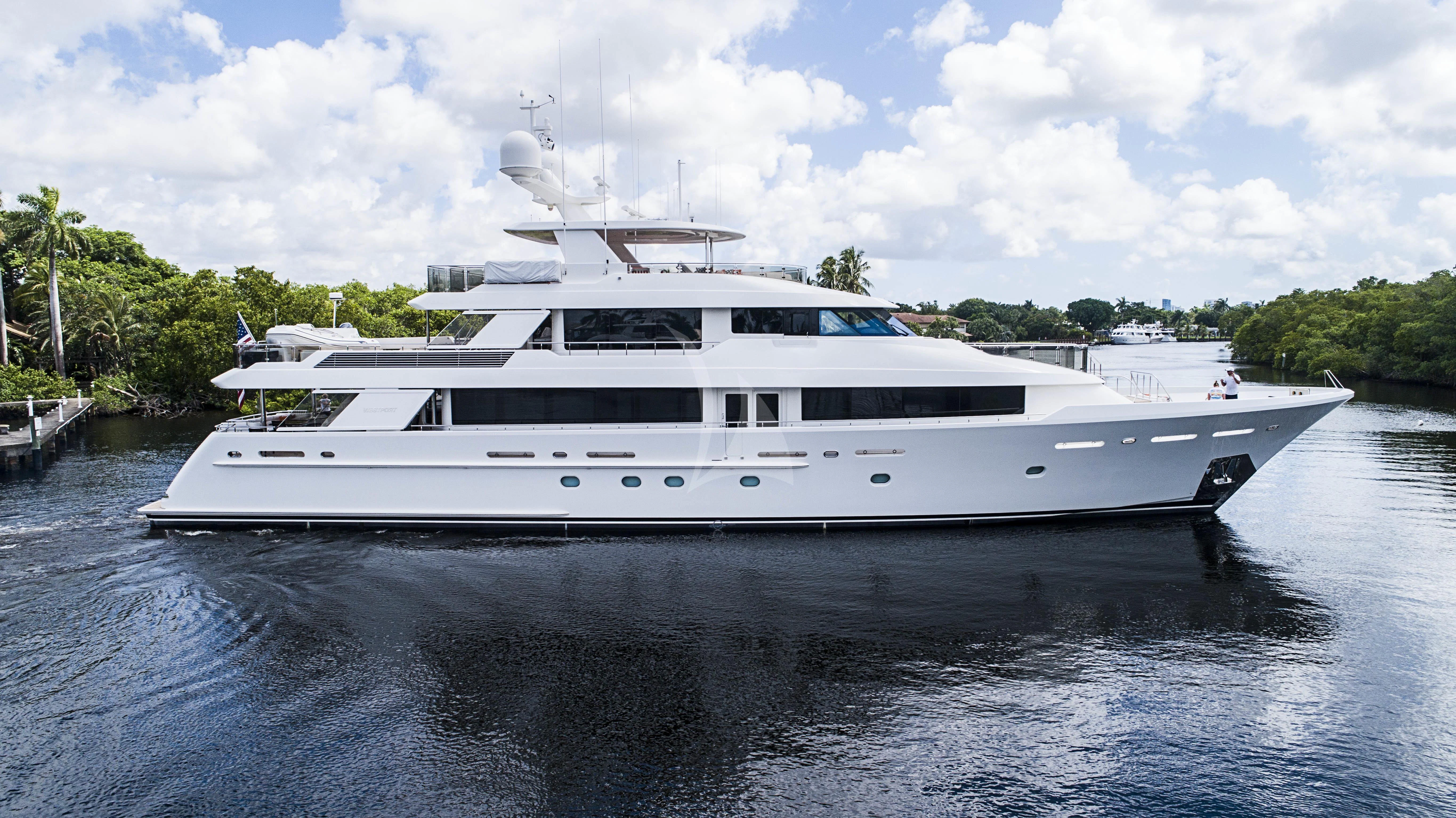 a white yacht on the water aboard DRILLER Yacht for Sale