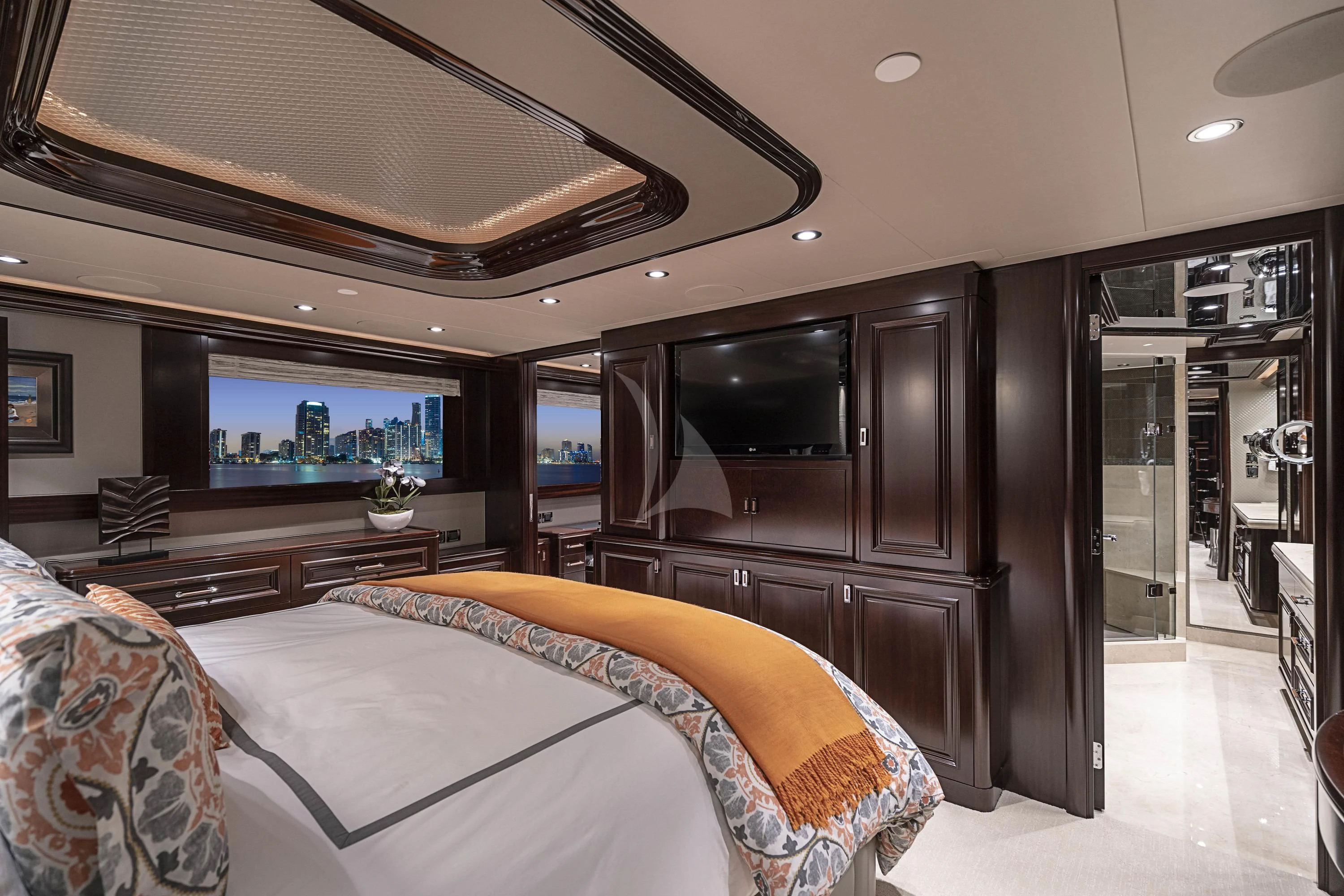 a bedroom with a large bed aboard DRILLER Yacht for Sale