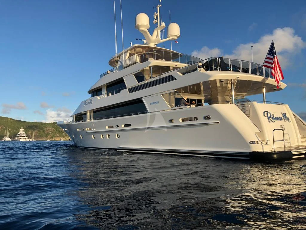 a large white ship with a flag on it aboard DRILLER Yacht for Sale