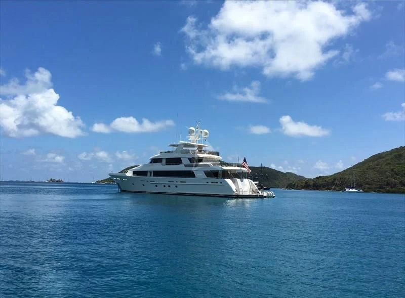 a white yacht in the water aboard DRILLER Yacht for Sale