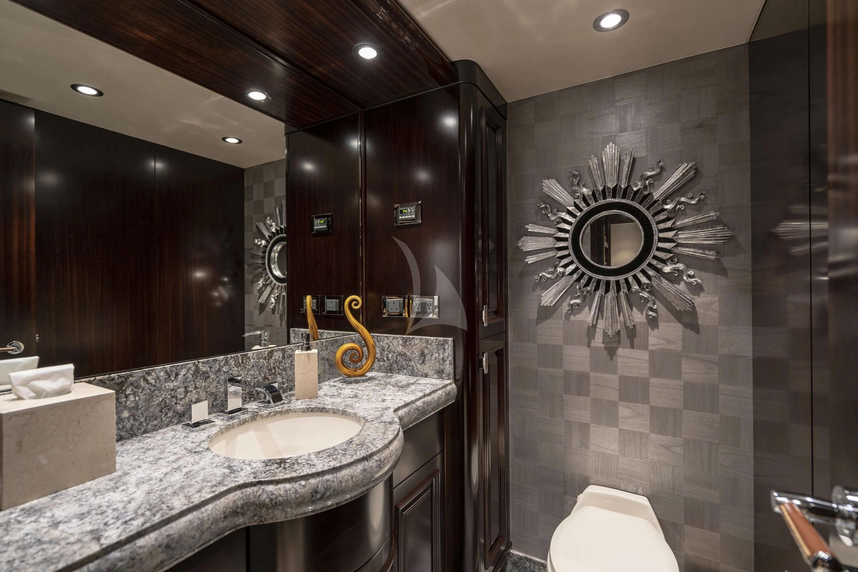 a bathroom with a sink and a mirror aboard DRILLER Yacht for Sale