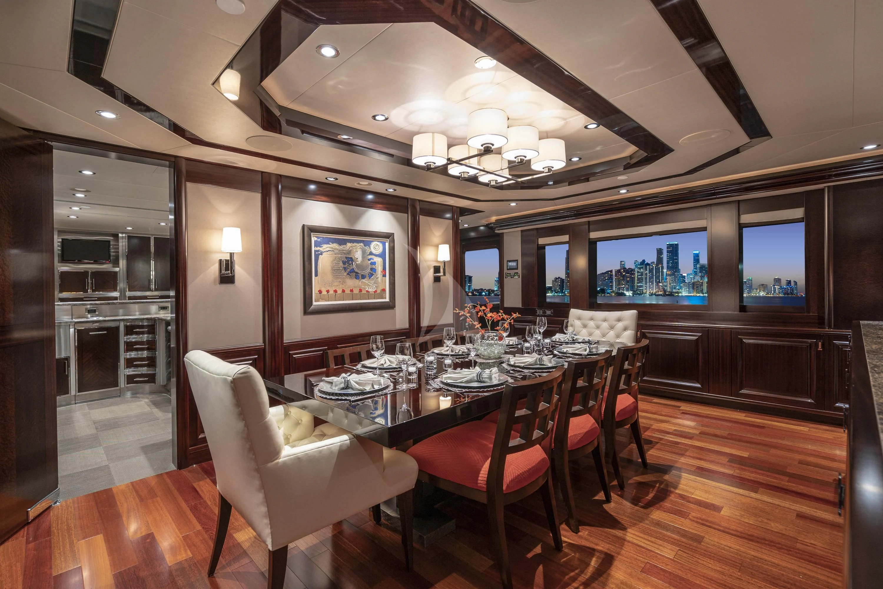 a dining room with a table and chairs aboard DRILLER Yacht for Sale