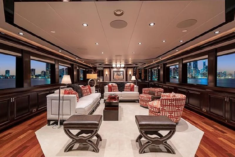 a living room with a large screen aboard DRILLER Yacht for Sale