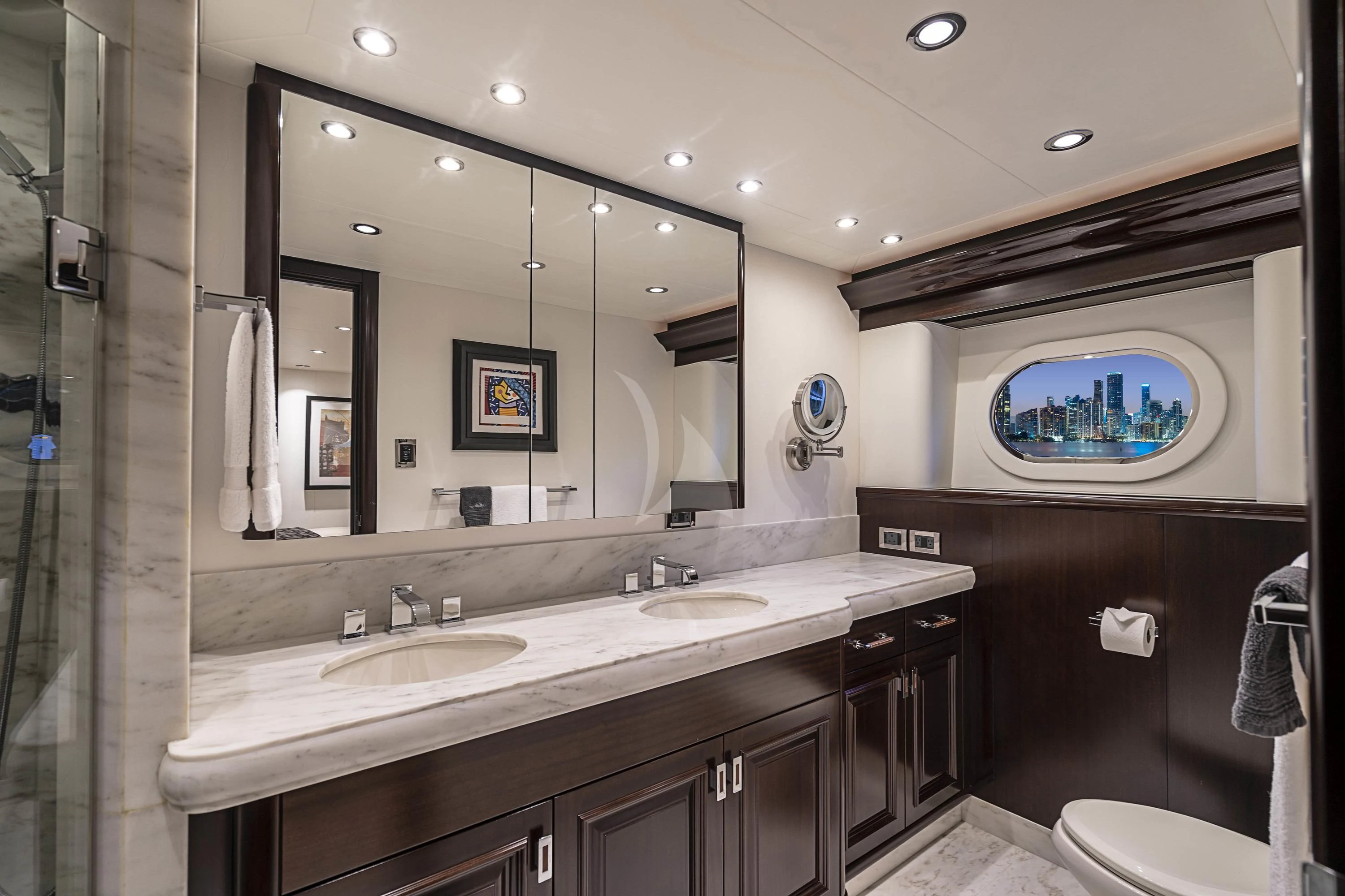 a bathroom with a large mirror aboard DRILLER Yacht for Sale