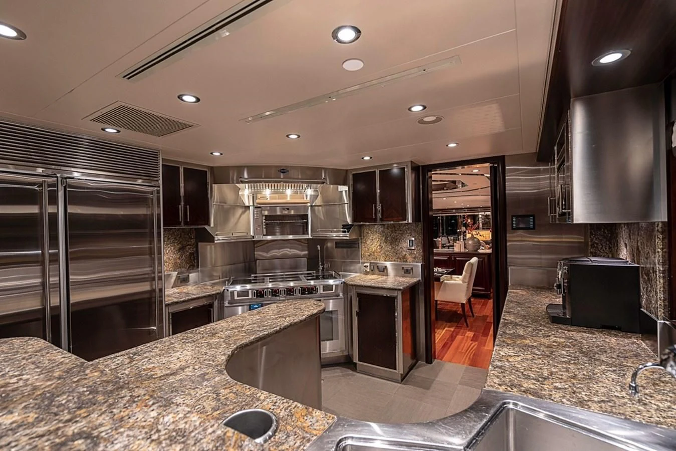 a kitchen with a marble counter top aboard DRILLER Yacht for Sale