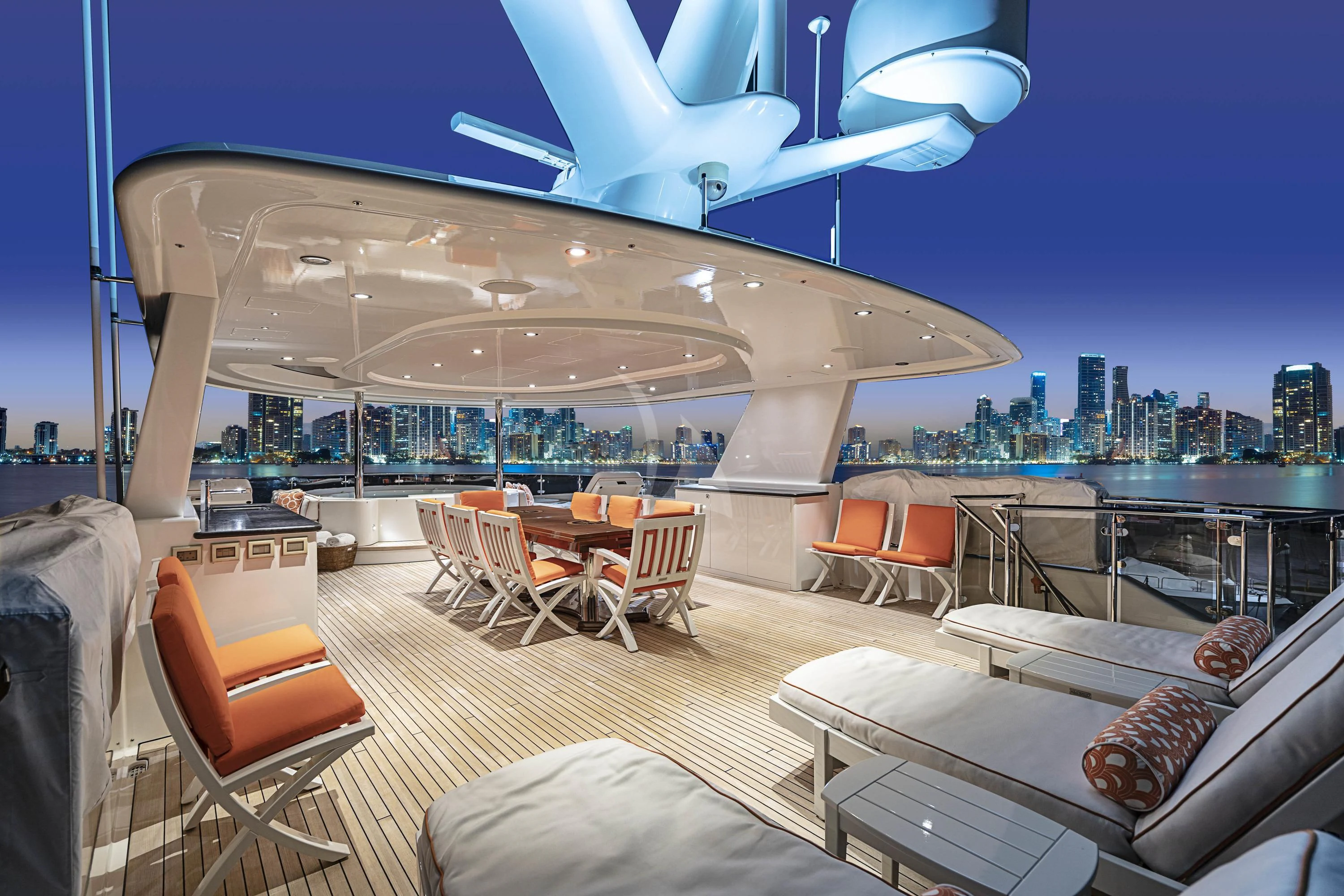 a room with a view of a city and the ocean aboard DRILLER Yacht for Sale