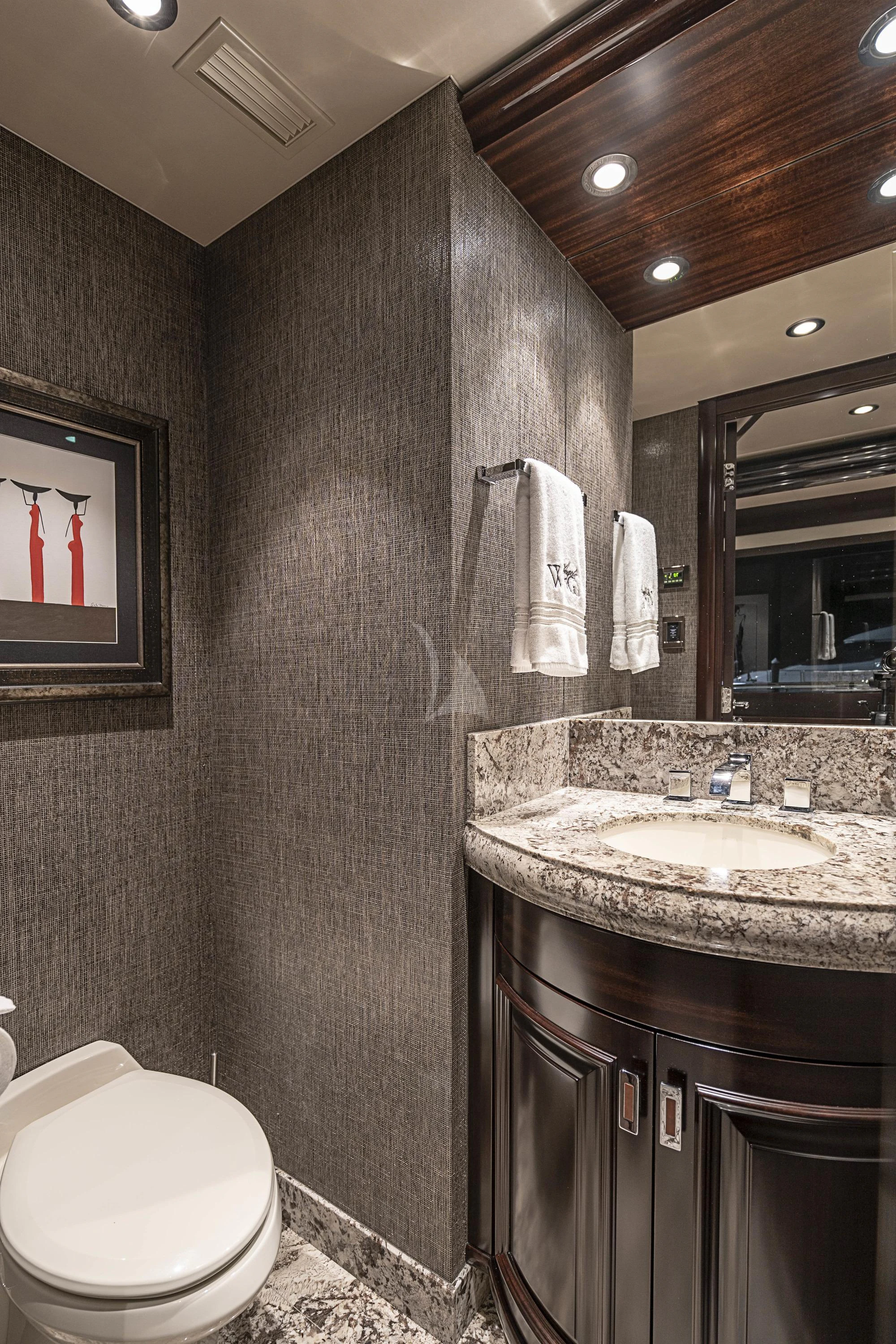 a bathroom with a sink and a toilet aboard DRILLER Yacht for Sale