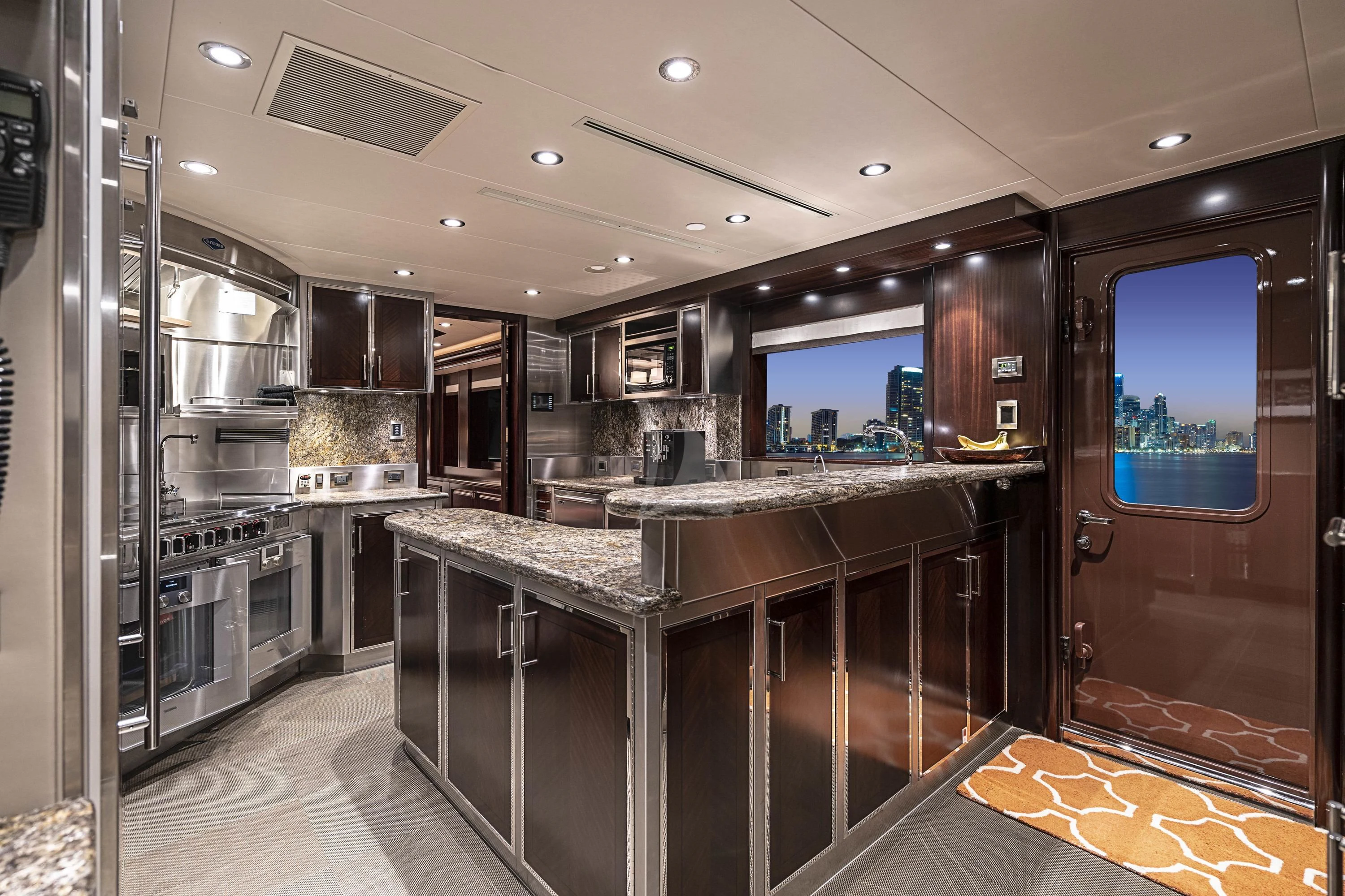 a kitchen with a large island aboard DRILLER Yacht for Sale