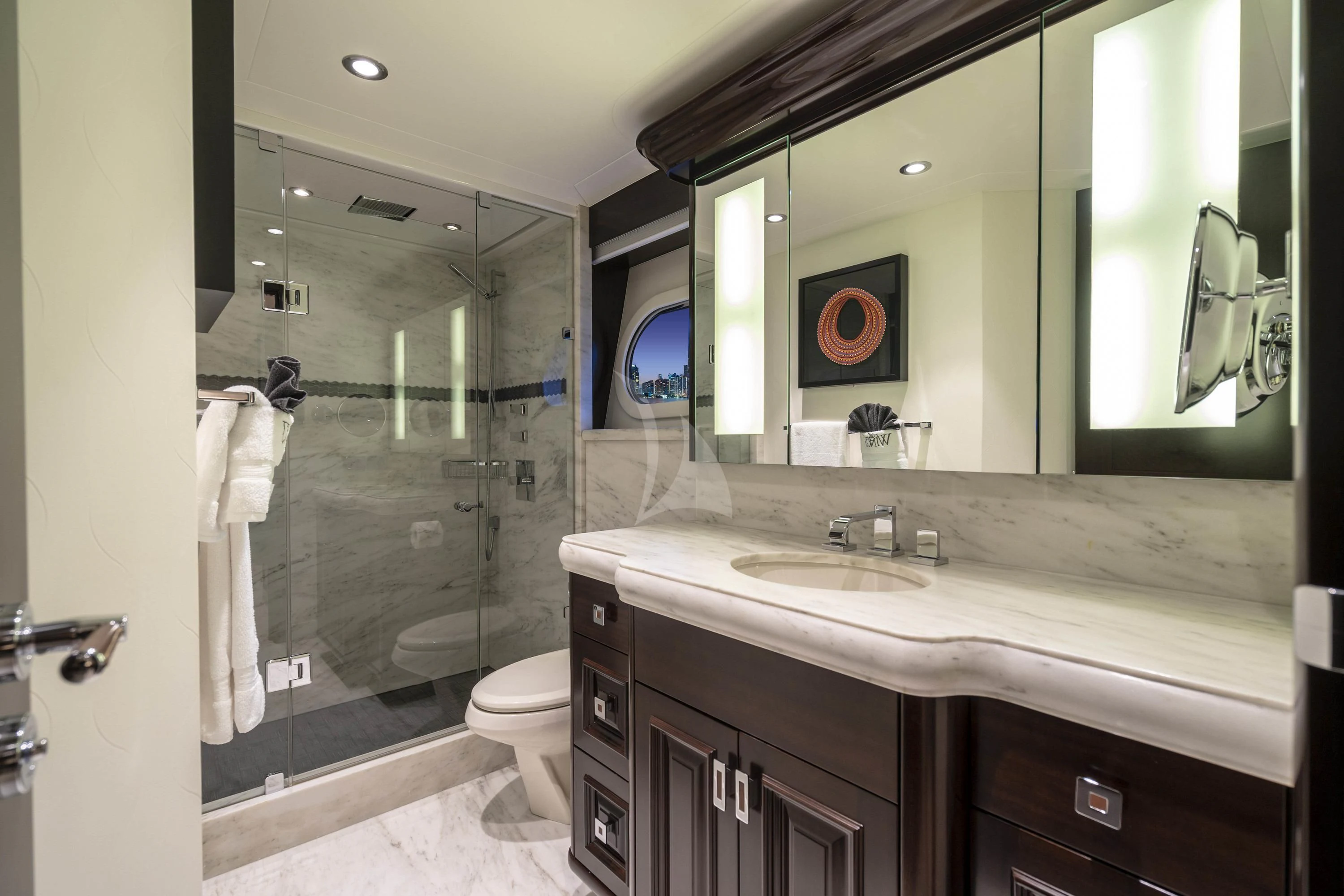 a bathroom with a glass shower aboard DRILLER Yacht for Sale