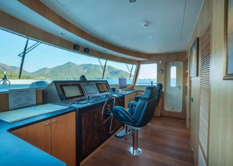 a room with a desk and a computer aboard MURAL YACHTS 85 TRAWLER Yacht for Sale
